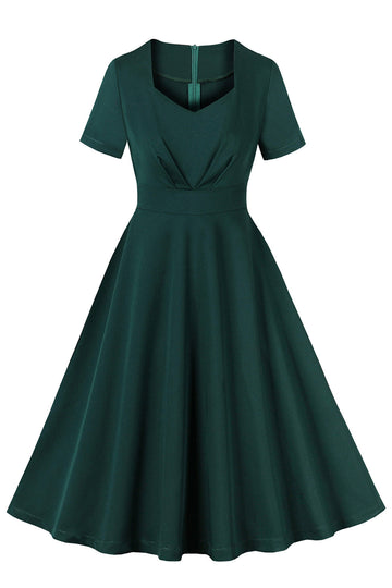 Vestido verde oscuro de manga corta con volantes de la década de 1950